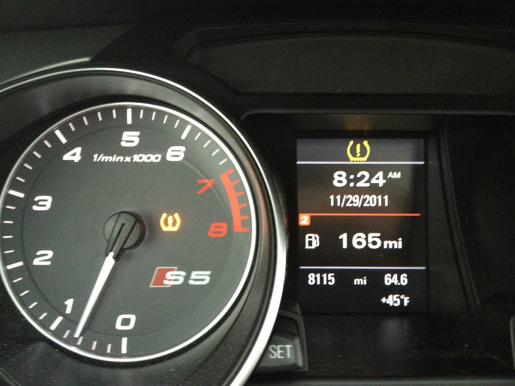 Low tire pressure warning light on a dashboard